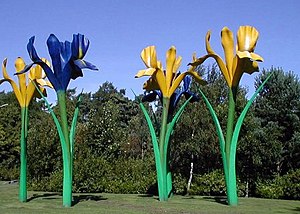 Fibre glass sculpture depicting four giant flowers, two blue and two yellow