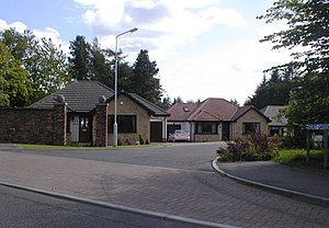 Modern detached bungalows in a cul de sac surrounded by mature landscaping